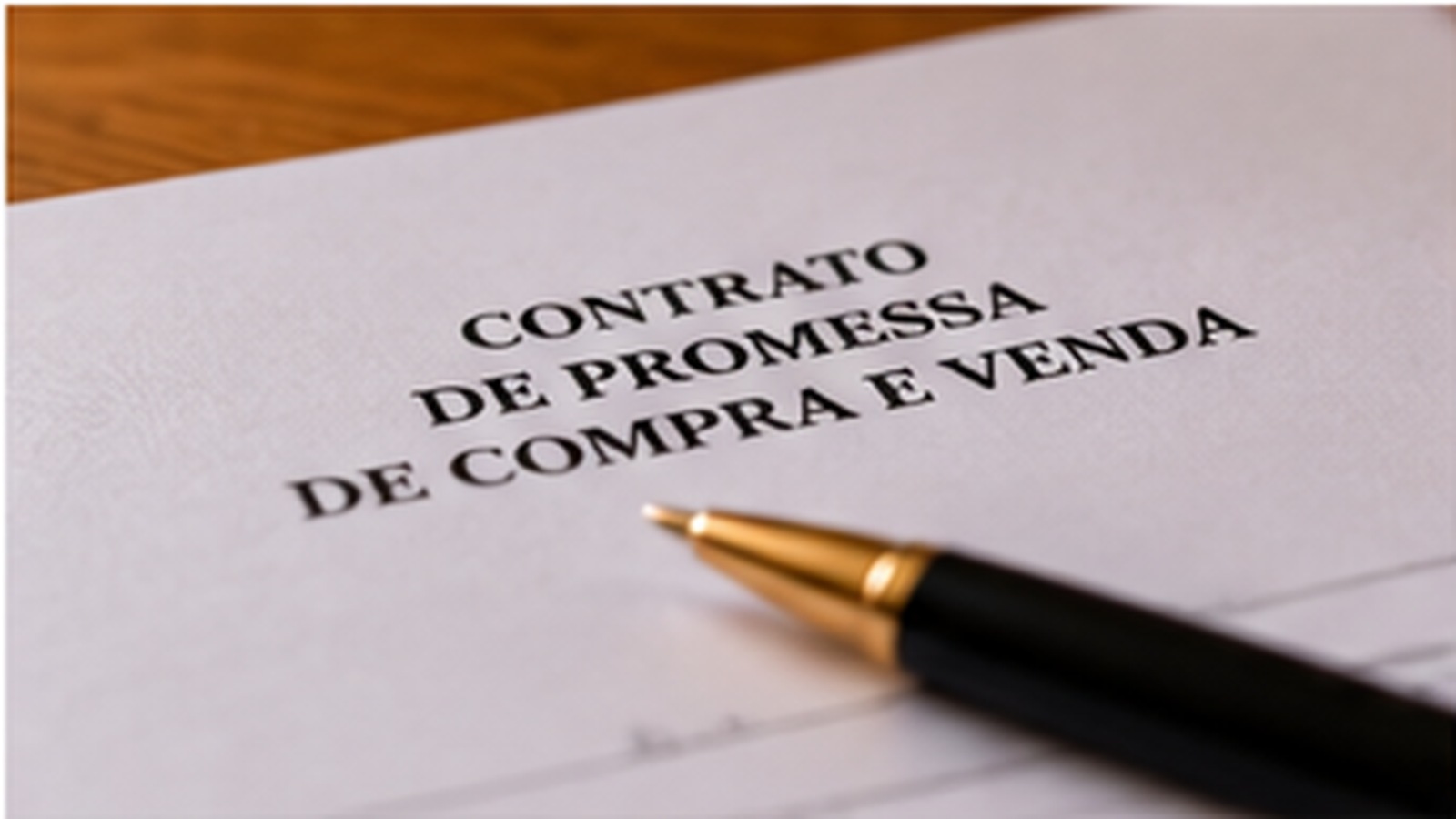 Portuguese property contract and pen prepared for legal review.