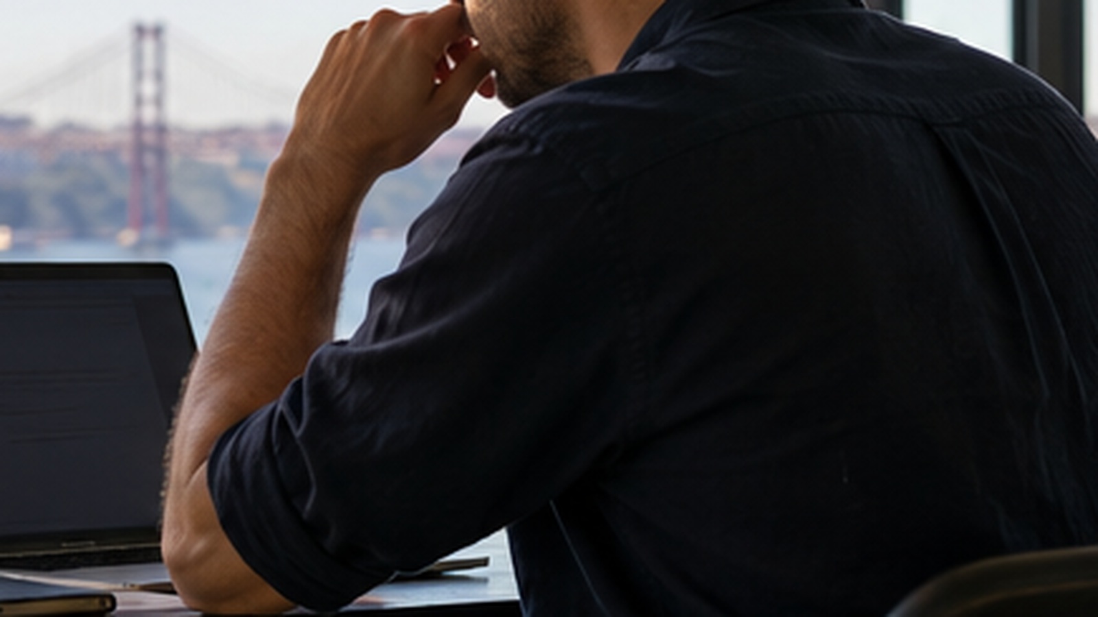 Independent professional reviewing remote-work and business documents in Portugal.