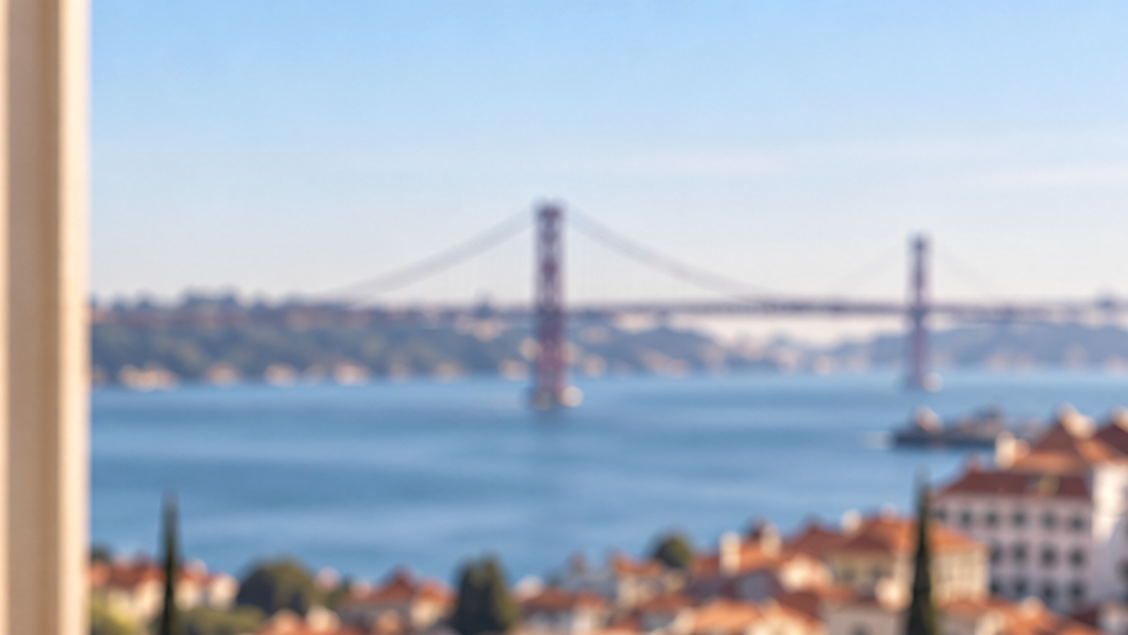 Text-free Lisbon and Tagus view from a professional office, illustrating profit distribution in a Portuguese company.